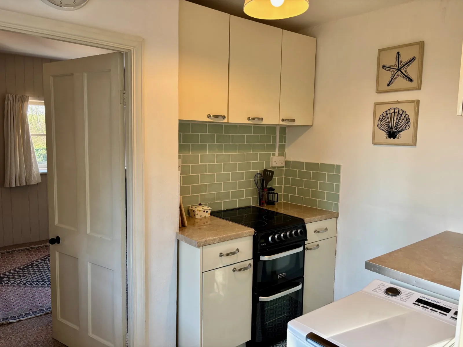 One bed flat, furnished, kitchen, living room with sofabed, woodburner, parking with EV Charger