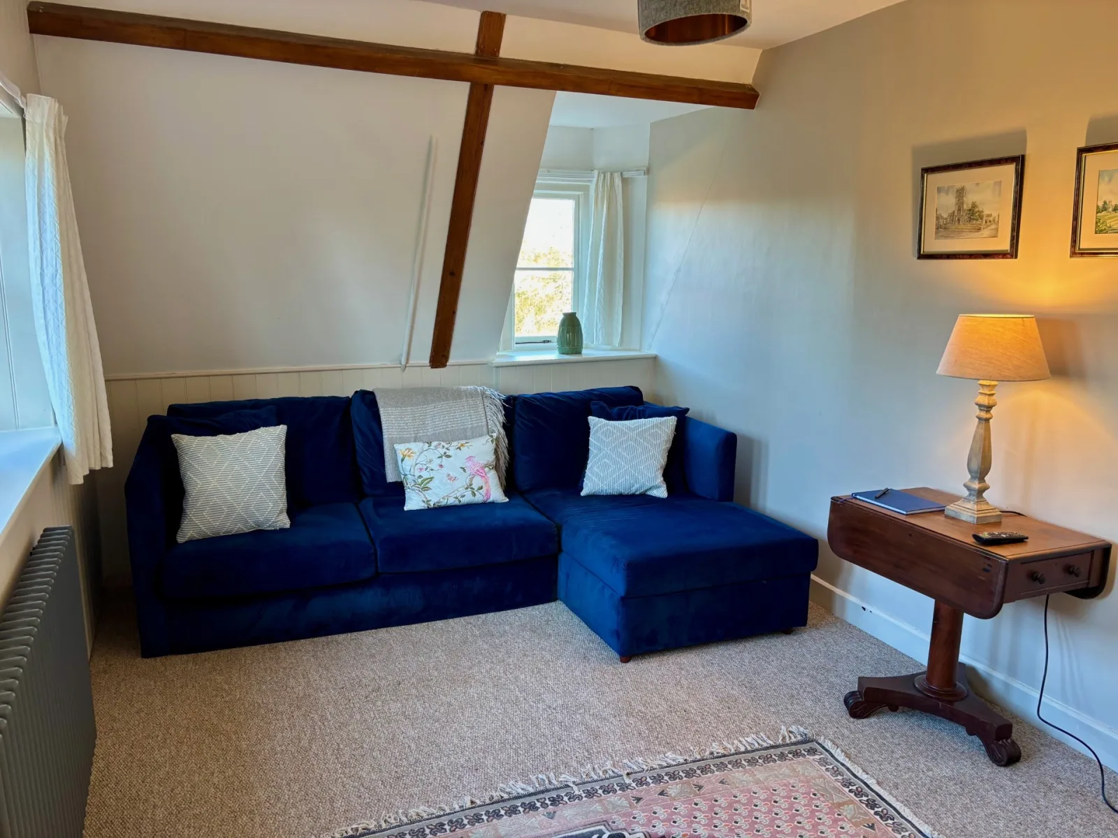 One bed flat, furnished, kitchen, living room with sofabed, woodburner, parking with EV Charger